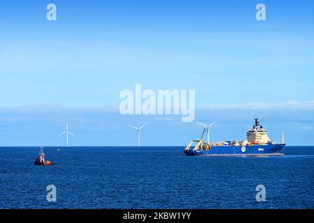 Ile De Brehat French cable laying repair ship and utility vessel MCS ANNEKE lying off Tynemouth in the North sea by the windfarm Stock Photo