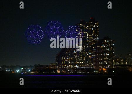 Over 500 drones display a light show over the Hudson River to celebrate the 10th anniversary of the mobile game Candy Crush Saga on November 3, 2022 i Stock Photo