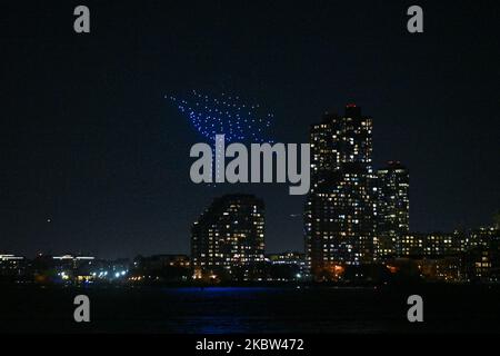 Over 500 drones display a light show over the Hudson River to celebrate the 10th anniversary of the mobile game Candy Crush Saga on November 3, 2022 i Stock Photo