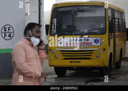 A man speaks on a mobile phone in front of an ambulance parked outside a free COVID-19 test centre in Mumbai, India on July 27, 2020. India has become the third country after the United States and Brazil, to cross 01 million COVID-19 cases. (Photo by Himanshu Bhatt/NurPhoto) Stock Photo