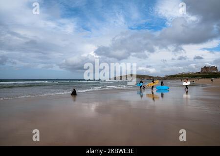 Newquay, United Kingdom - 4 Spetember, 2022:view of Fistral Beach in Newquay with surfers enjoying a summer day Stock Photo