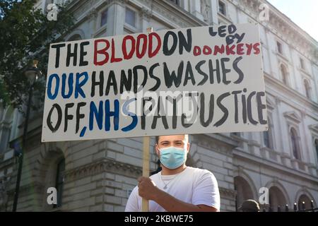 NHS staff protest outside Downing Street after marching from St Thomas's Hospital at the 'March For Pay Justice for NHS and Key Workers' on 29 July, 2020 in London, England. Protesters demonstrate against not being included in the government's pay deal for public sector workers amid the sacrifices and hardship experienced during the coronavirus pandemic. (Photo by Lucy North MI News/NurPhoto) Stock Photo