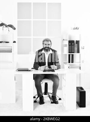 Man sit office. Business director. Bearded hipster creative director. Advocacy and jurisprudence. Legal services director. Case manager track Stock Photo