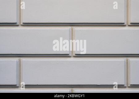 Background from a wall with rectangular beige stone slabs Stock Photo