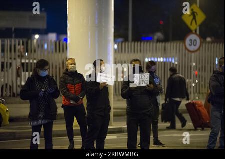 Families reunite with their close ones in El Dorado international Airport after flights were grounded in Colombia due to the novel coronavirus pandemic on August 1 2020 in Bogota, Colombia. (Photo by Sebastian Barros/NurPhoto) Stock Photo