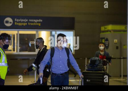 Families reunite with their close ones in El Dorado international Airport after flights were grounded in Colombia due to the novel coronavirus pandemic on August 1 2020 in Bogota, Colombia. (Photo by Sebastian Barros/NurPhoto) Stock Photo