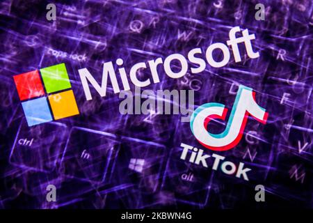 TikTok and Microsoft logos displayed on a screen and keyboard are seen in this multiple exposure illustration photo taken on August 3, 2020. Microsoft is interested in purchase TikTok platform in the United States. (Photo Illustration by Jakub Porzycki/NurPhoto) Stock Photo