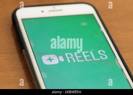 New feature 'Reels' logo is seen displayed on a phone screen in this illustration photo taken in L'Aquila, Italy, on August 5, 2020. Facebook launches his new feature ''Reels'' on Instagram in 50 countries around the world. This feature will be a competitor of the famous social network TikTok. (Photo illustration by Lorenzo Di Cola/NurPhoto) Stock Photo