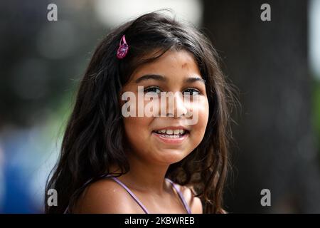 A young girl smiles in the city during the new Coronavirus disease (COVID-19) after the decrease of coronavirus infected in Belgrade, Serbia on August 5, 2020. The number of coronavirus infections is decreasing throughout Serbia. The government mandates the mandatory use of masks indoors and outdoors to halt the spread of the coronavirus disease (COVID-19). (Photo by Nikola Krstic/NurPhoto) Stock Photo