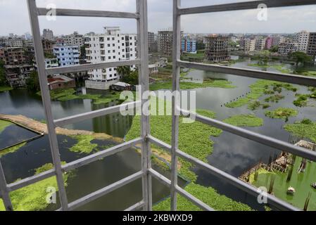 Houses are seen surrounded by the flood water at Lowland area of the Dhaka City in Bangladesh, on August 8, 2020 (Photo by Mamunur Rashid/NurPhoto) Stock Photo