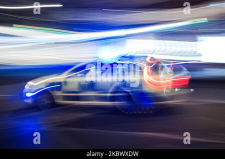 A police car on an emergency call races along Oxford Street in the early hours of the morning in London, England, on August 8, 2020. (Photo by David Cliff/NurPhoto) Stock Photo