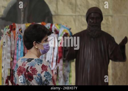 A woman from the Lebanese community in Mexico prays inside the Parish of Our Lady of Lebanon in Mexico City, Mexico on August 9, 2020 in memory of the victims after an explosion in the port of Beirut, Lebanon. (Photo by Gerardo Vieyra/NurPhoto) Stock Photo