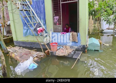 Villager sits in his house seen surrounded by the flood water in Savar near Dhaka, Bangladesh, on August 10, 2020 (Photo by Mamunur Rashid/NurPhoto) Stock Photo