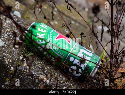 Belgrade, Serbia - November 02, 2022: Heineken beer can discarded in the middle of a street in Belgrade. Stop pollution, start Recycling and save our Stock Photo