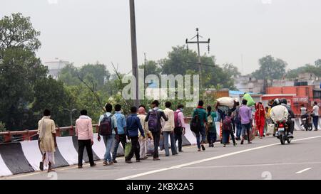 Migrants seen returning to New Delhi as lockdown restrictions ease further under Unlock 3 guidelines, at Mahatma Gandhi Marg near ISBT Kashmiri Gate on August 11, 2020 in New Delhi, India. (Photo by Mayank Makhija/NurPhoto) Stock Photo