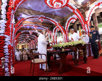 Chamal Rajapaksa (L), the elder brother of prime minister Mahinda Rajapaksa takes oaths to be appointed as Sri Lanka's cabinet minister of Irrigation and state minister of Internal Security by his younger brother, president Gotabaya Rajapaksa while prime minister, Mahinda Rajapaksa looks on during an event for the swearing in of the new cabinet ministers at the historical â€œMagul Maduwaâ€/ 'Assembly Hall' situated at the Temple of the Sacred Tooth Relic where the ancient Sri Lankan kings met their ministers and carried out daily administrative tasks at Kandy, Sri Lanka on 12 August 2020. (Ph Stock Photo