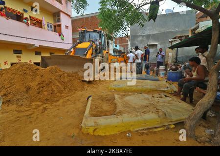Vehicles submerged in mud as landslide brought in sand to low laying ...