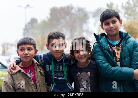 Belgrade, Serbia - November 02, 2022: Group of cute gypsy kids in Belgrade. Serbian Roma children are living in poverty. Help people in need Stock Photo