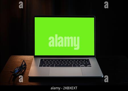 Laptop with green blank screen Stock Photo