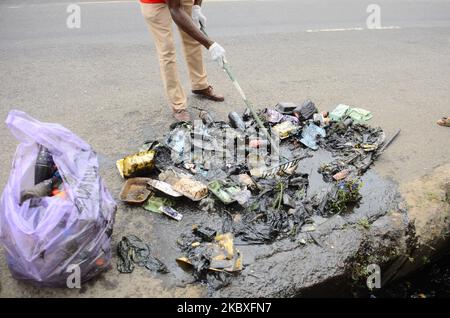 Groups of volunteers picking waste on the road sides and drainages in Lagos, Nigeria on August 23, 2020. A non-governmental organization African Clean-Up Initiative (ACI) partnered with NGOâ€™s and volunteers to clean up motor parks in Town Planning Way, Oshodi under bridge, Anthony and Ilupeju and also clean up 13 streets along Ilupeju, Oshodi area. A global social action program aimed at combating the global solid waste problem, in preparation toward expected rainfall and flood in Nigeria. (Photo by Olukayode Jaiyeola/NurPhoto) Stock Photo