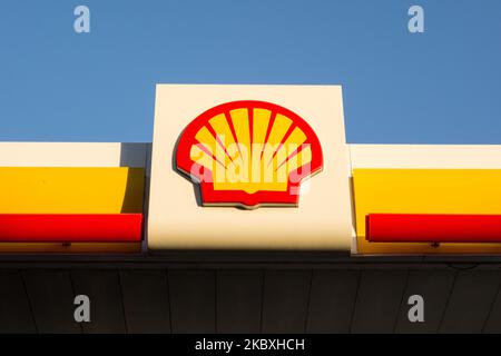 The Shell logo on branding on a petrol station forecourt in England, UK Stock Photo