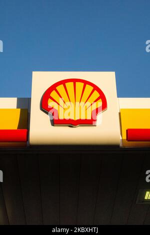 The Shell logo on branding on a petrol station forecourt in England, UK Stock Photo