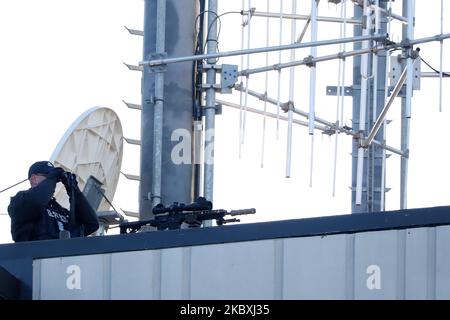 A police sniper keeps watch over the area as he keeps guard on the roof of Christchurch High Court prior to the third day of a four-day sentencing hearing for Brenton Harrison Tarrant in Christchurch, New Zealand, on August 26, 2020. Australian white supremacist Tarrant, 29, who carried out the attack on two mosques on 15 March 2019, will be sentenced on 51 counts of murder, 40 of attempted murder and one charge under the Terrorism Suppression Act. (Photo by Sanka Vidanagama/NurPhoto) Stock Photo