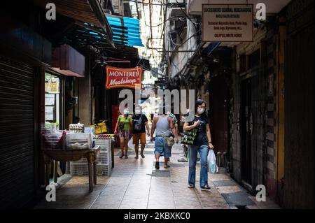 People shop and walk in Chinatown in Manila, Philippines on August 26, 2020. The Philippines’ economy shrank by 16.5% in the second quarter amid the pandemic.(Photo by Lisa Marie David/NurPhoto) Stock Photo