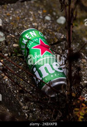 Belgrade, Serbia - November 02, 2022: Heineken beer can discarded in the middle of a street in Belgrade. Stop pollution, start Recycling and save our Stock Photo