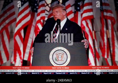 US President Donald Trump addresses the final night of the 2020 Republican National Convention, livestreamed online and viewed by laptop from London, England, on August 28, 2020. The president's speech, delivered from the grounds of the White House, caps four nights of programming from the Republican Party that has been taking place against a backdrop of serious unrest in the city of Kenosha, Wisconsin, sparked by the police shooting of a black man there last Sunday. America's election season is set to intensify over the coming weeks, with a first debate between President Trump and his Democra Stock Photo