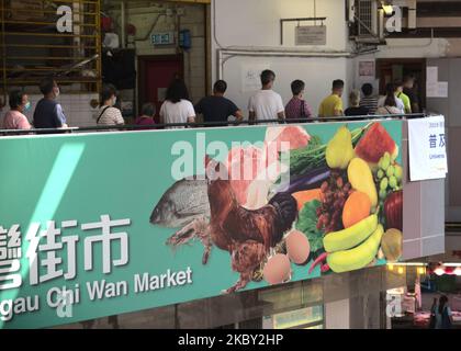 On day three of 'universal testing' for Covid 19 in Hong Kong, China, on September 2, 2020, some longer queues appeared at some testing centres such as Ngau Chi Wan. This testing centre is located near the epicenter of two outbreaks of coronavirus, namely Ping Shek estate, where a restaurant was the location of the start of the contamination chain of the third wave, and Choi Hung estate, also a location where a number of positive cases were found. Despite an appointment system in place, some queues reaching over 100 m long were formed, extending on an overpass used by people visiting the local Stock Photo