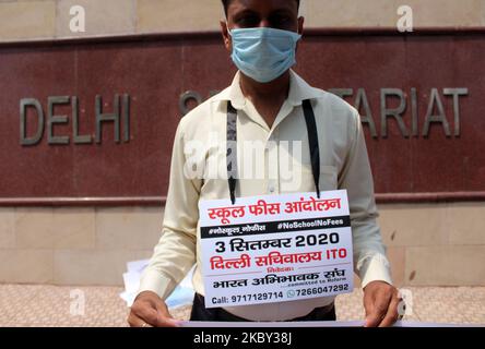 A protester seen holding placard during a protest against schools demanding full fees amid the Covid-19 pandemic at Delhi Secretariat on September 3, 2020 in New Delhi, India. (Photo by Mayank Makhija/NurPhoto) Stock Photo