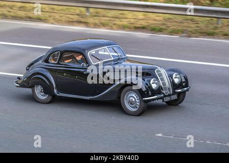 1939 30s thirties pre-war black German Frazer Nash Bmw 328 2107 cc sedan,  sports car of the pre-war years, travelling on the M6 motorway UK Stock Photo