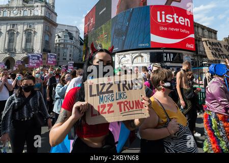 Transgender people and their supporters march past Piccadilly Circus during London's second Trans Pride protest march for equality on 12 September, 2020 in London, England. Protesters demand legal recognition for non-binary people, an end to non-consensual surgeries on intersex people, and a progressive reform of the UK’s Gender Recognition Act – the law that governs the way adult trans men and women gain legal recognition of their gender. (Photo by WIktor Szymanowicz/NurPhoto) Stock Photo