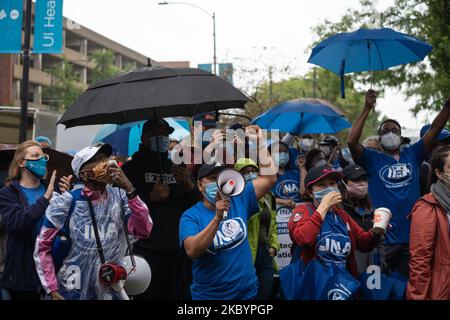 Nurses at the University of Illinois Hospital (UIH) rally on the first day of their strike in Chicago, IL on September 12, 2020. Hundreds of UIH nurses are demanding safe patient limits and adequate personal protective equipment. (Photo by Max Herman/NurPhoto) Stock Photo