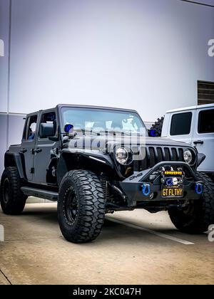 The front view of the Black 2018 Jeep Wrangler JLU car, close-up, vertical Stock Photo