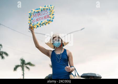 A protester holds a placard that says 'Marcos No Hero' during the demonstration. Hundreds of Youth and students lead a broad multi-sectoral rally at the UP Diliman in Quezon City on the eve of the 48th anniversary of the commemoration of the declaration of Martial Law by the Ousted dictator Marcos. Various groups of the dictatorial rule of President Duterte. Quezon City, Metro Manila, Philippines, September 21, 2020. (Photo by Mohd Sarajan/NurPhoto) Stock Photo