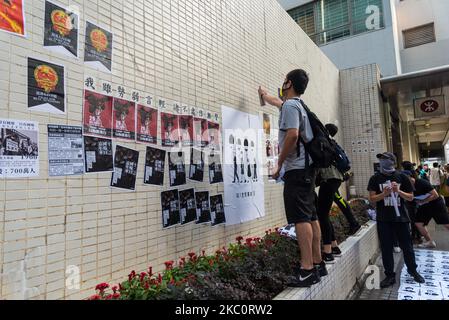 Protesters stick posters on a wall in Wanchai, Hong Kong, China, on 28 Sep 2019. (Photo by Marc Fernandes/NurPhoto) Stock Photo