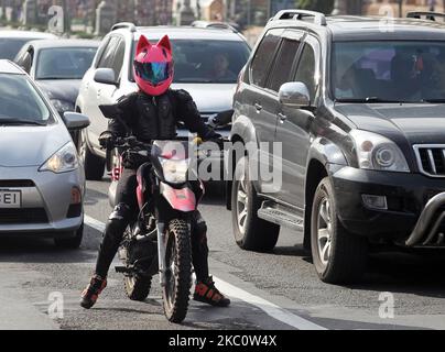 A motorcyclist drives a motorbike in the center of Kyiv, Ukraine on 29 September 2020. (Photo by STR/NurPhoto) Stock Photo