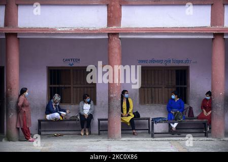 Primary School teachers of Prabhat Madhyamik Vidhyalaya, a government based school lining to teach in classes along with face mask after six months of complete closure due to COVID-19 pandemic fear at Thankot, Kathmandu, Nepal on September 30, 2020. Schools started resuming its classes with a proper safety measures and standard guidelines concerned towards local government's decisions. (Photo by Narayan Maharjan/NurPhoto) Stock Photo