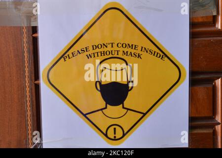 A sticker ' Please don't come inside without mask' seen at the entrance to Dzhumaya Mosque, in Plovdiv center. On October 2nd, 2020, in Plovdiv, Bulgaria. (Photo by Artur Widak/NurPhoto) Stock Photo