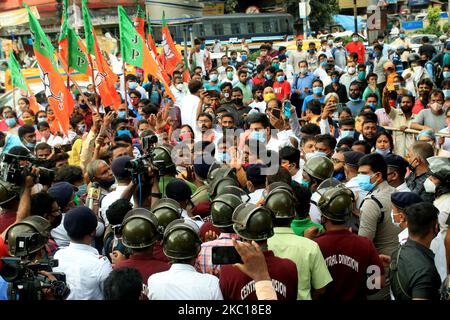 Bharatiya Janata Party (BJP) workers agitation at front of NRS Hospital,Massive police deployment was seen at the hospital as BJP supporters raised slogans, demanding justice for the slain BJP leader Manish Shukla. BJP Supporters in front of the NRS hospital when the body was brought for for post-mortem in the afternoon.They broke police barricades and got engaged in a scuffle with police officials.The police failed to control the situation initially in Kolkata on October 05,2020. BJP leader Manish Shukla was shot dead on Sunday evening, Titagar 20 km from north Kolkata. (Photo by Debajyoti Ch Stock Photo