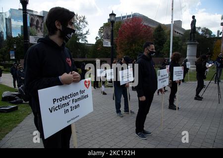 Families who lost loved ones in the destruction of Flight PS752 held protests today in Toronto, Canada on October 5, 2020. Iran's military shot down the Ukraine International Airlines flight shortly after takeoff in Tehran on Jan. 8, killing all 176 passengers onboard -- including 55 Canadian citizens and 30 permanent residents. (Photo by Sayed Najafizada/NurPhoto) Stock Photo