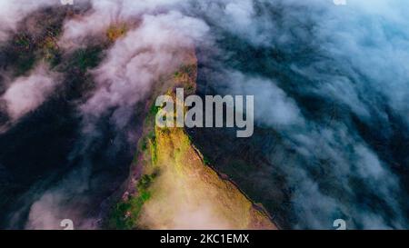 mount Batur of Bali drone shot which is covered in clouds on a beautiful sunrise Stock Photo