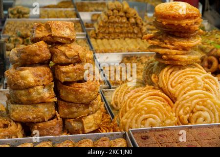 moroccan chebakia and varied pastry cookies for sale at the market, street. food and business concept. Selective focus. Stock Photo