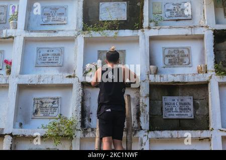 Families of passed love ones are starting to visit the cemetery in Antipolo City, Philippines, on October 13, 2020. The Government of Antipolo City announced that this coming October 26 to November 4, all cemeteries are close to avoid the massive count of visitors and also to curb the virus. (Photo by Ryan Eduard Benaid/NurPhoto) Stock Photo