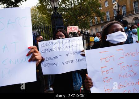 Activists protesting police brutality by the Nigerian Special Anti-Robbery Squad (SARS) demonstrate on Whitehall in London, England, on October 15, 2020. SARS has been accused of extrajudicial killings, extortion and torture, prompting demonstrations across Nigeria in the past week that have continued despite authorities there now agreeing to disband the unit, which is to be replaced by a Special Weapons and Tactics (SWAT) team. (Photo by David Cliff/NurPhoto) Stock Photo