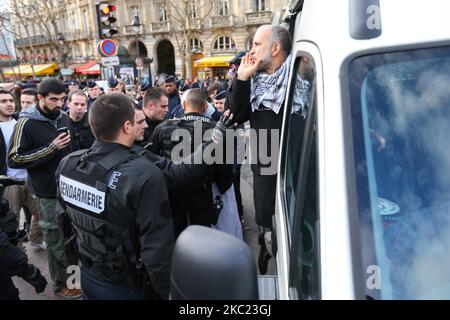 This picture taken on December 29, 2012, in Paris, shows the President of the Cheikh Yassine collective Abdelhakim Sefrioui (C with a white djellaba) being arrested by French anti-riot gendarmes after a protest to support Palestine. Abdelhakim Sefrioui is involved in the France teacher attack near the College du Bois d'Aulne, in the town of Conflans-Sainte-Honorine, some 30km (20 miles) north-west of central Paris, on october 16, 2020. The number arrested rose to 11 on october 18, with police investigating possible links to Islamic extremism. (Photo by Michel Stoupak/NurPhoto) Stock Photo