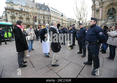 This picture taken on December 29, 2012, in Paris, shows the President of the Cheikh Yassine collective Abdelhakim Sefrioui (C with a white djellaba) protesting in front of French anti-riot gendarmes to support Palestine. Abdelhakim Sefrioui is involved in the France teacher attack near the College du Bois d'Aulne, in the town of Conflans-Sainte-Honorine, some 30km (20 miles) north-west of central Paris, on october 16, 2020. The number arrested rose to 11 on october 18, with police investigating possible links to Islamic extremism. (Photo by Michel Stoupak/NurPhoto) Stock Photo