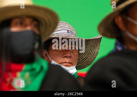 Indigenous members of the CRIC and other indigenous associations of Colombia, camp at 'El Palacio de los Deportes' after a week long trip on colombian roads to protest against the social leaders assasinations, the massacres in the country, and the implementation of the peace process, in Bogota, Colombia, october 20, 2020. Indigenous leaders gave a press conferences along orginizers of the national strike to show support in the demonstrations that will take in the city on october 21. (Photo by Sebastian Barros/NurPhoto) Stock Photo